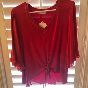 Red knotted blouse